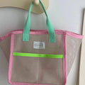 Transparent pink mesh bag for poolside and beach use