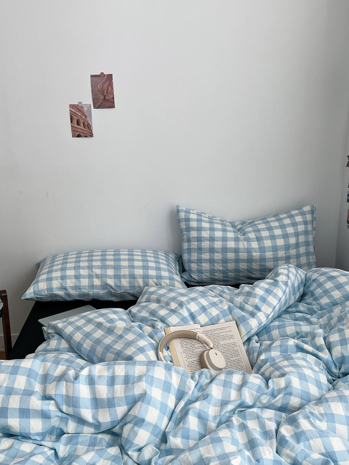 Preppy college bedding with a light blue gingham duvet cover and dark contrast pillows