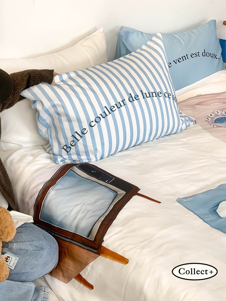 Rabbit print duvet cover with blue lettering and oversized bunny artwork