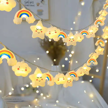 String lights with cloud and rainbow designs in a room setting.