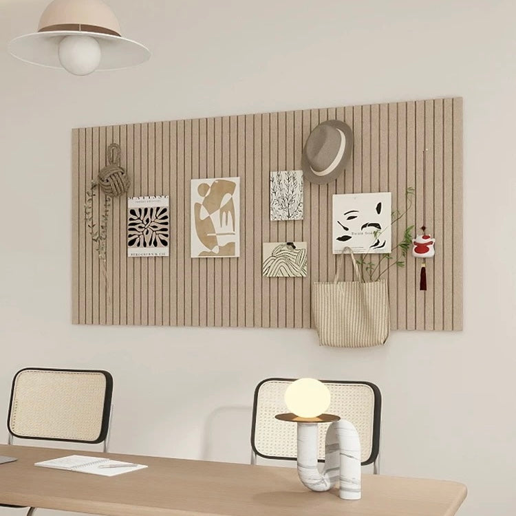 Modern office interior with a desk, chairs, and wall art.