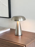 Silver Scandinavian LED lamp with touch control glowing softly