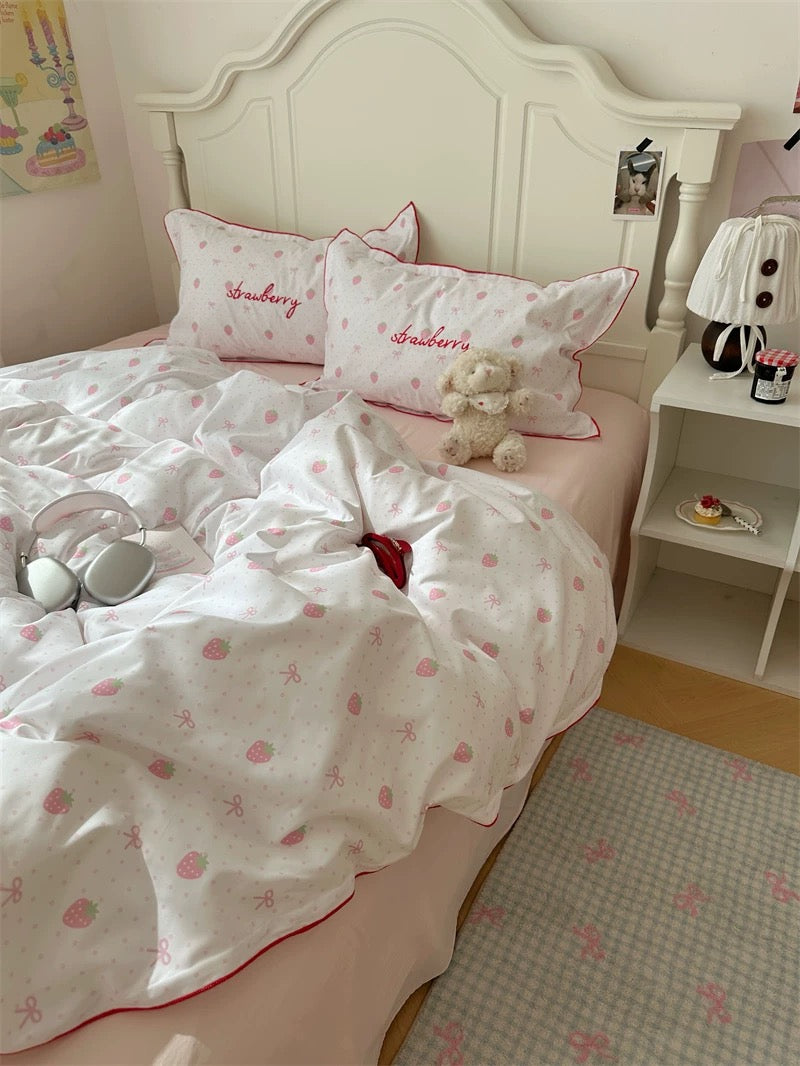 Bedroom with strawberry-themed bedding and decor