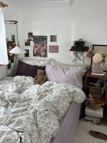 Romantic floral bedding set styled with botanical accents and layered pillows creating warm inviting bedroom retreat naturally.