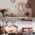 Minimalist Scandinavian room with natural light and moon phase mirror wall art