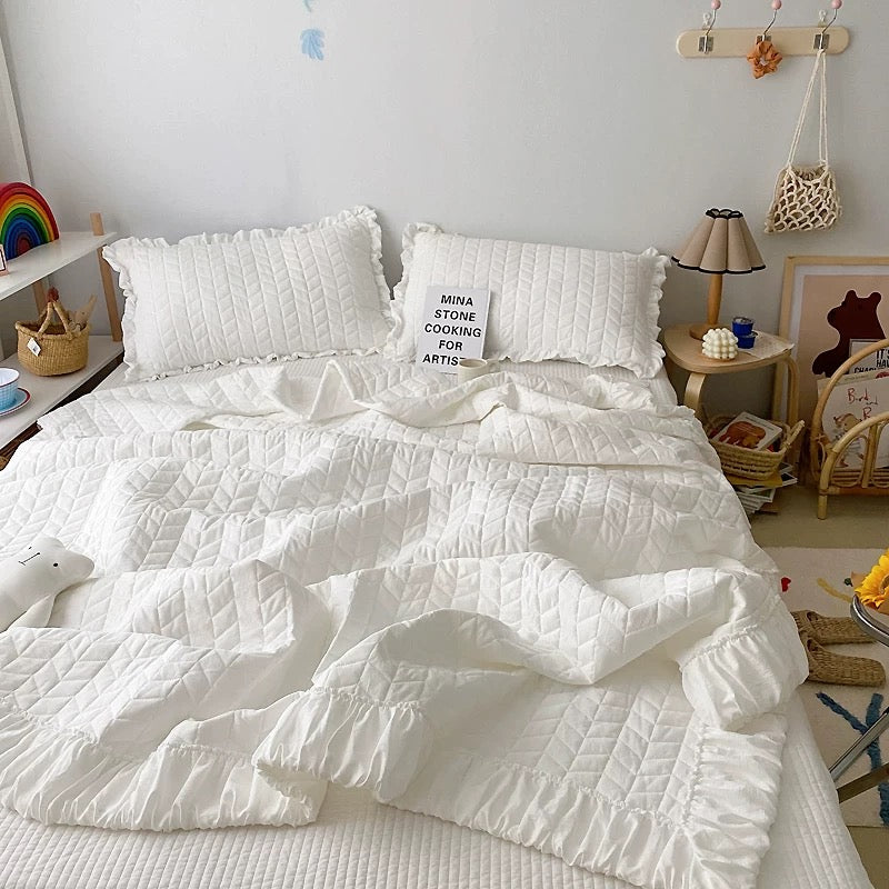 Ruffle bedding set with lightweight quilted blanket and matching pillowcases