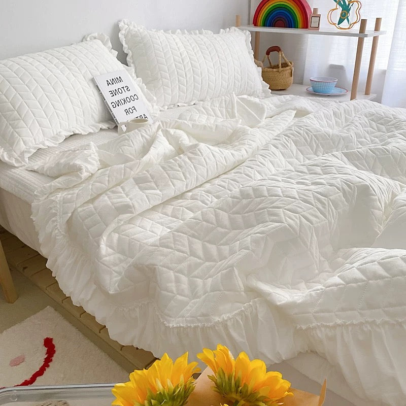 Ruffle bedding set with quilted texture and solid color design