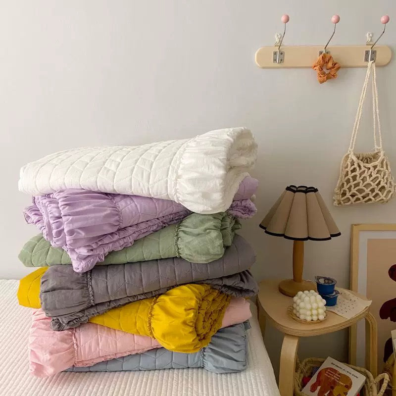 Ruffle bedding set with solid color blanket and matching pillowcases