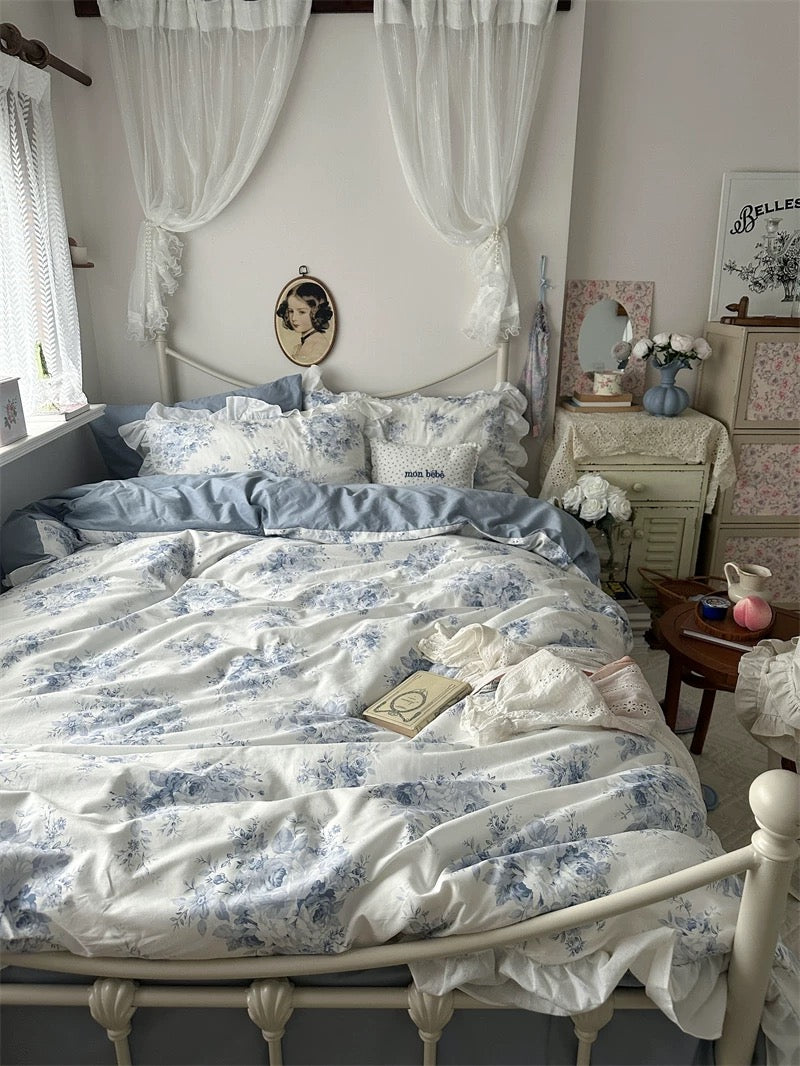 Blue floral lace bedding styled for a cottagecore aesthetic with cozy vibes.