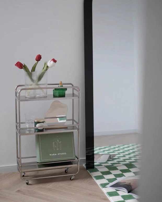 Silver rolling shelf cart styled as a café-inspired coffee bar with mugs and candles.