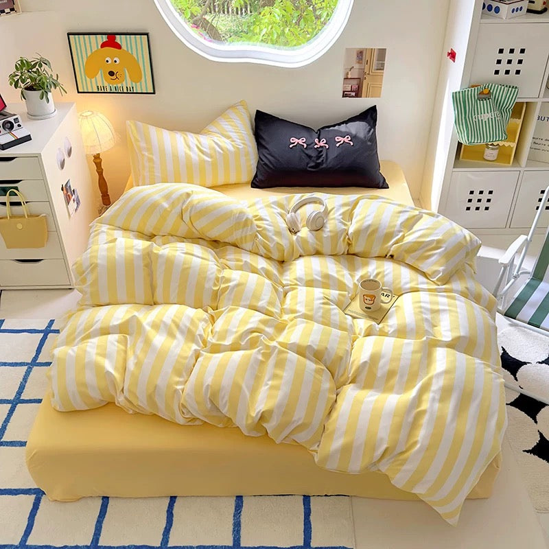 Full view of the 4-piece bedding set, including duvet cover, flat sheet, and two pillowcases.