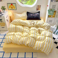 Full view of the 4-piece bedding set, including duvet cover, flat sheet, and two pillowcases.