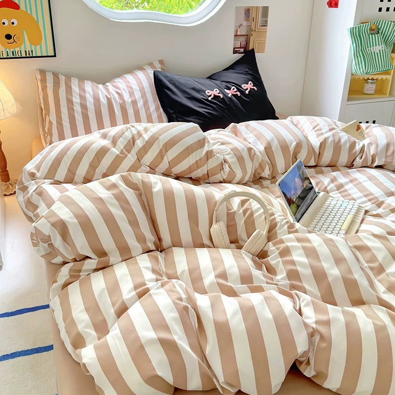 Beige striped cotton bedding set styled in a soft girl dorm room