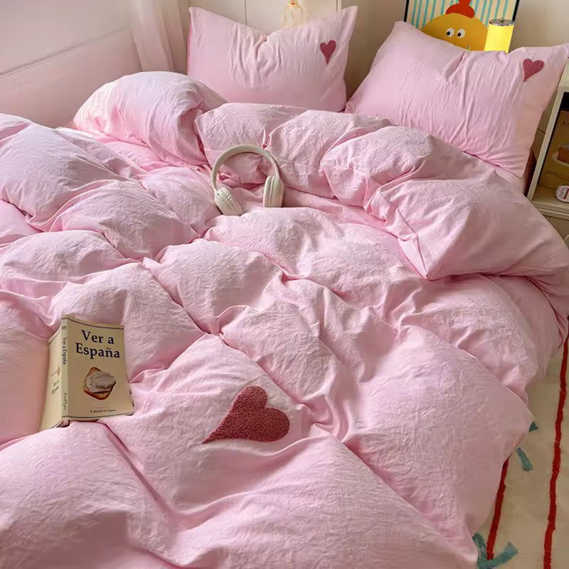Teen girl's dorm room featuring soft girl aesthetic bedding and decor.