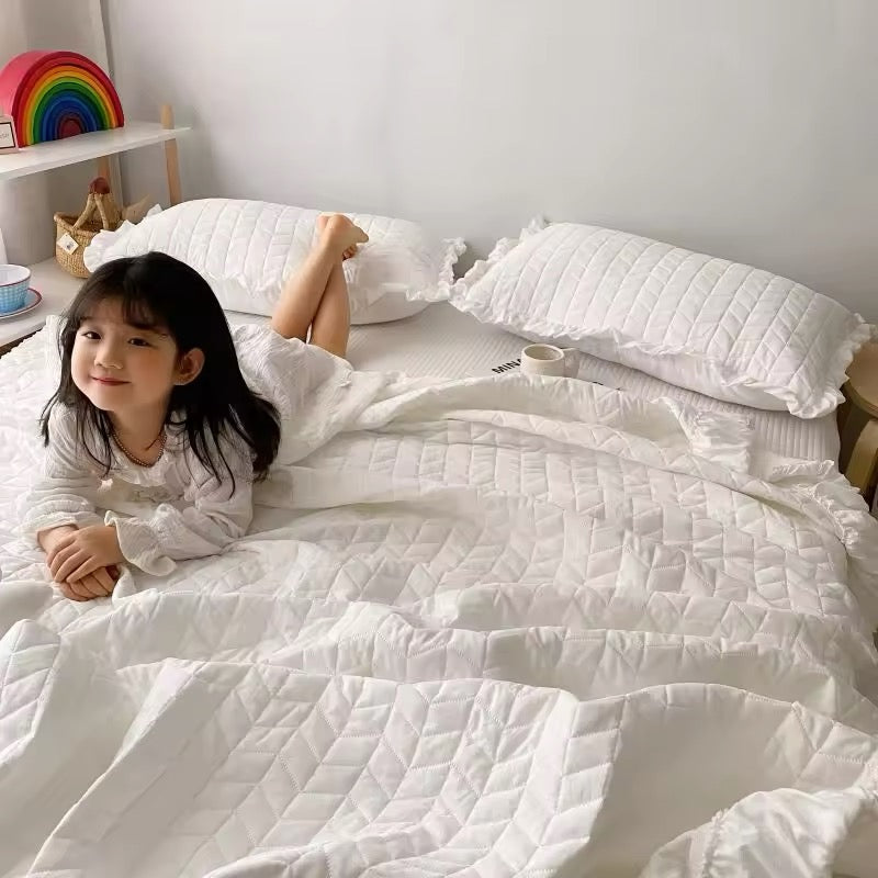 Solid color ruffle bedding set with stitched quilted texture