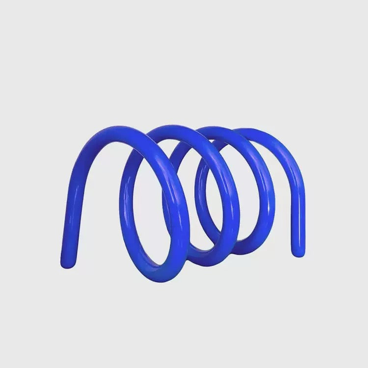 Nordic spring book rack used on coffee table, creating aesthetic storage while displaying favorite reading books beautifully.