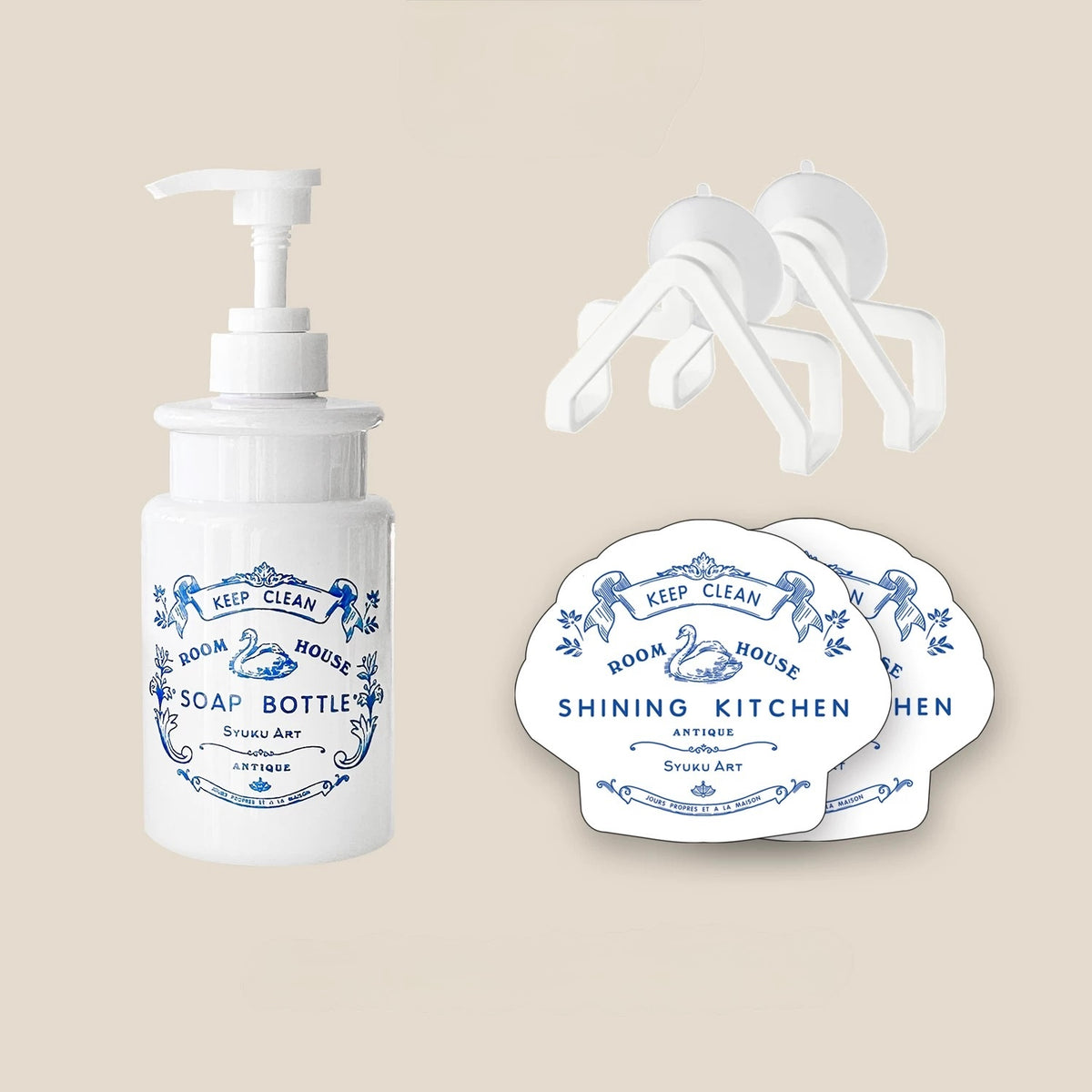 A swan soap dispenser is shown with two matching dish sponges and two white suction cup sponge holders.