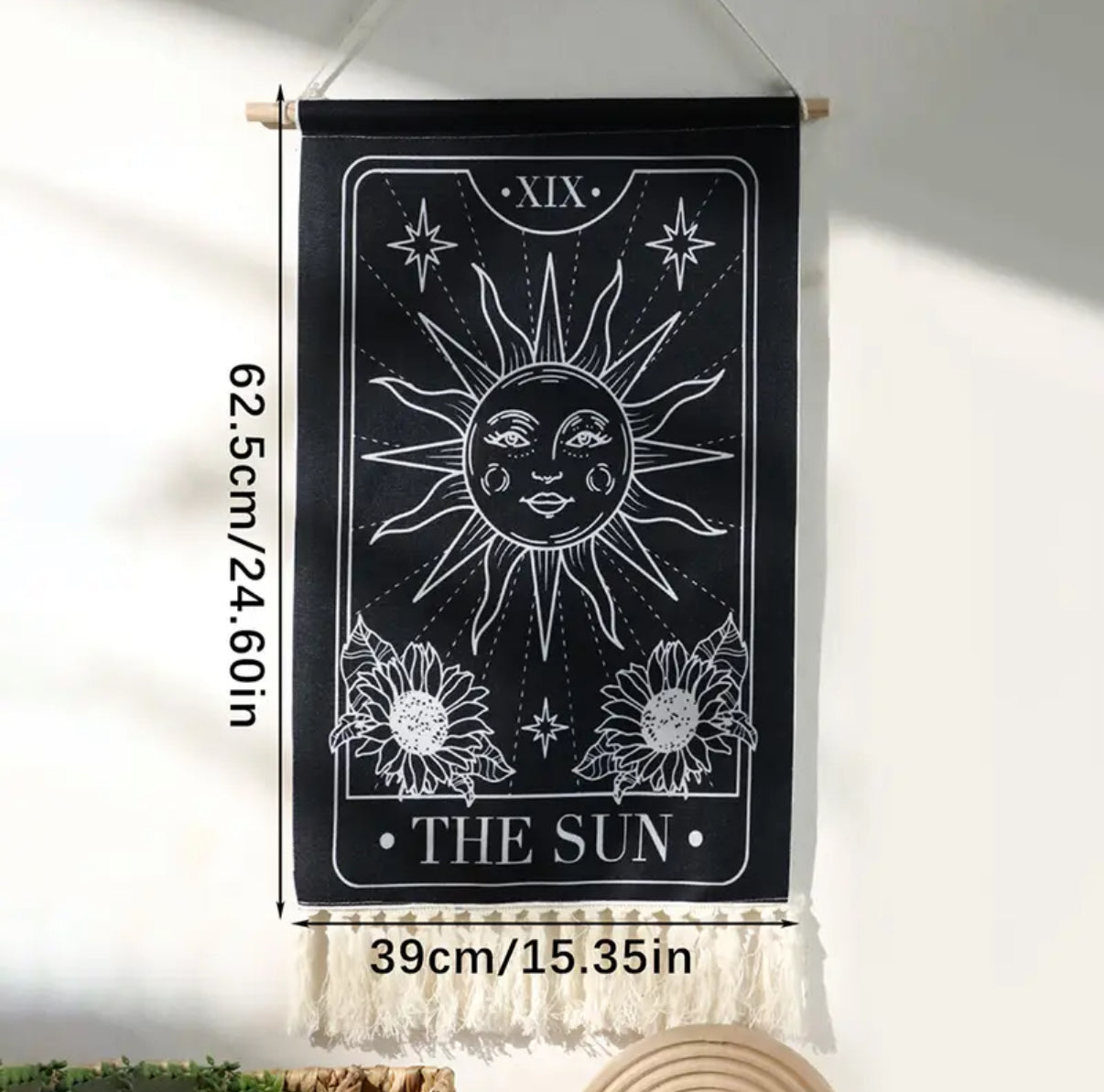 Decorative wall hangings featuring vintage astrology art in soft natural lighting.