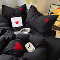 Gothic soft girl bed styled with cozy throw and red heart comforter