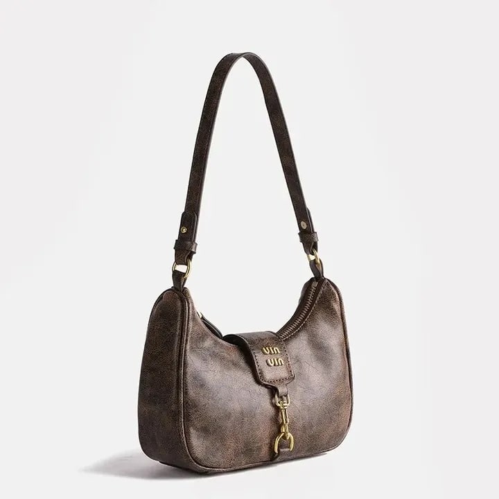Vintage crescent retro bag with PU leather. Stylish Y2K underarm bag for women featuring a coffee color and niche Maillard style.