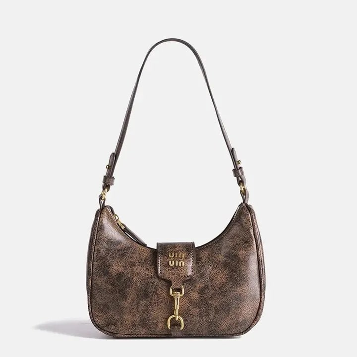 Vintage crescent retro bag with PU leather. Stylish Y2K underarm bag for women featuring a coffee color and niche Maillard style.
