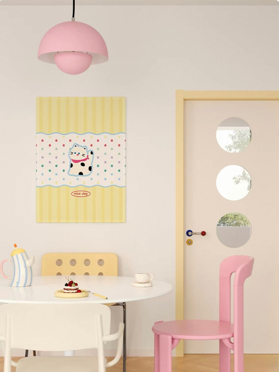 A yellow striped cat tapestry has a spotted cat in a cream dotted band between yellow panels with blue wavy lines.